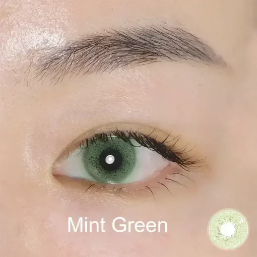 mint green colored contacts wearing detail